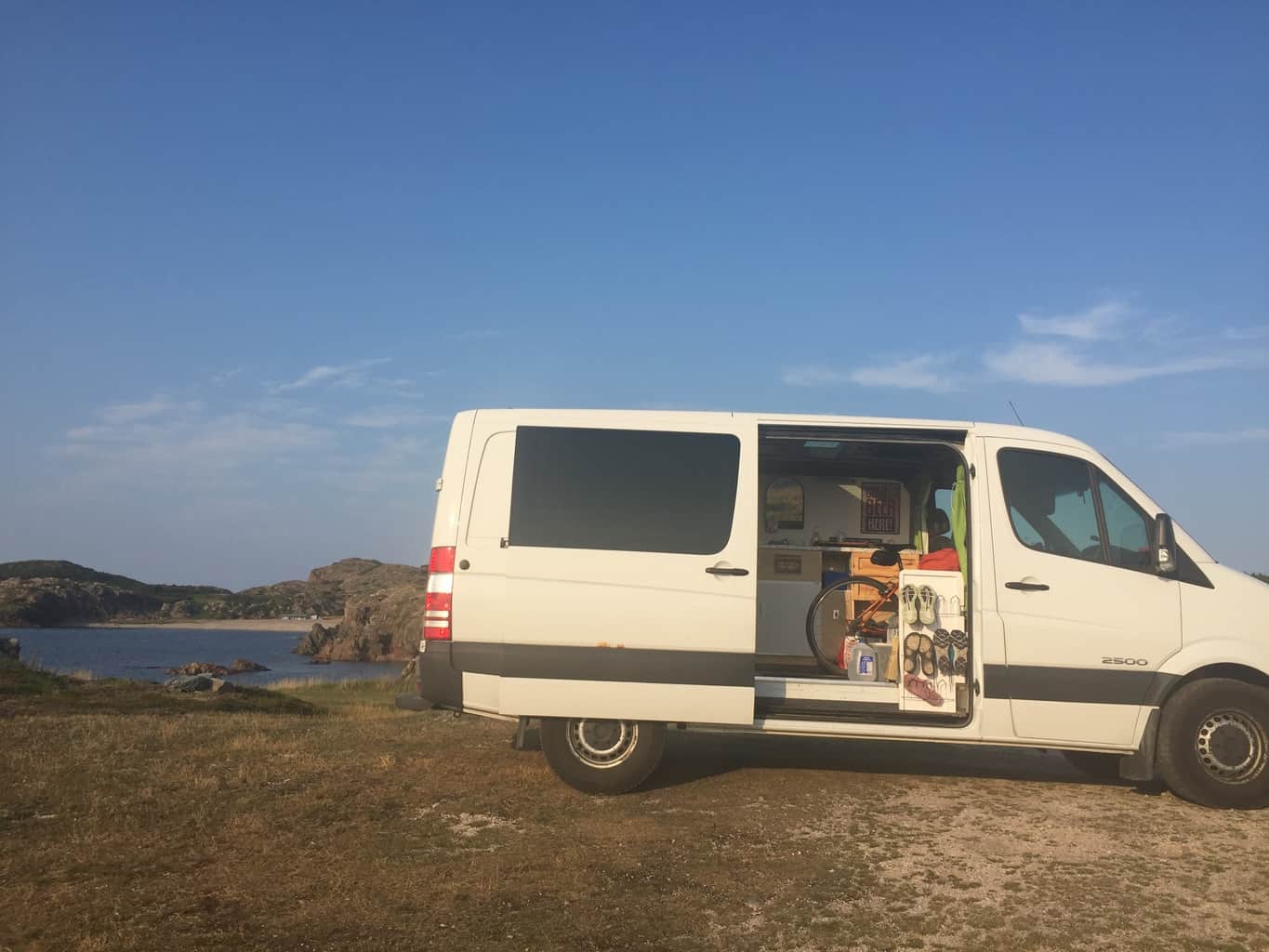 The van parked by the ocean