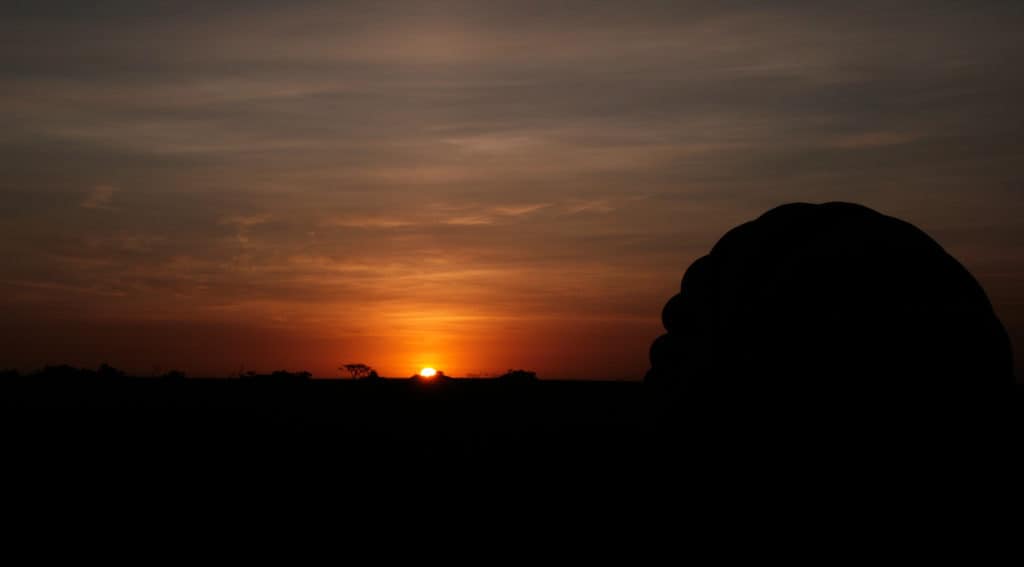 Sunrise over the Serengeti in Tanzania with balloon in foreground