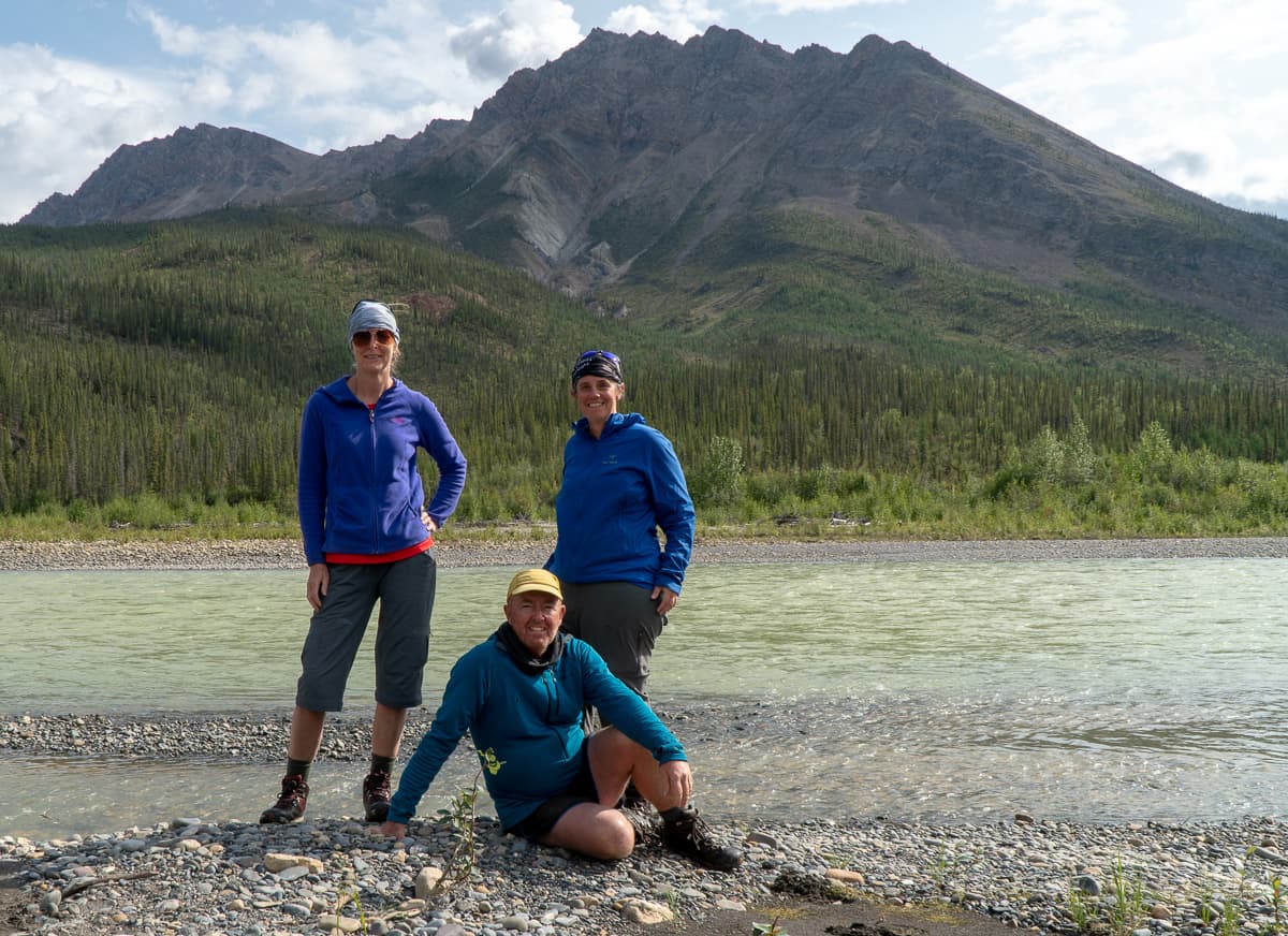 The three hikers on the shore of the Twitya River on the Canol Heritage Trail