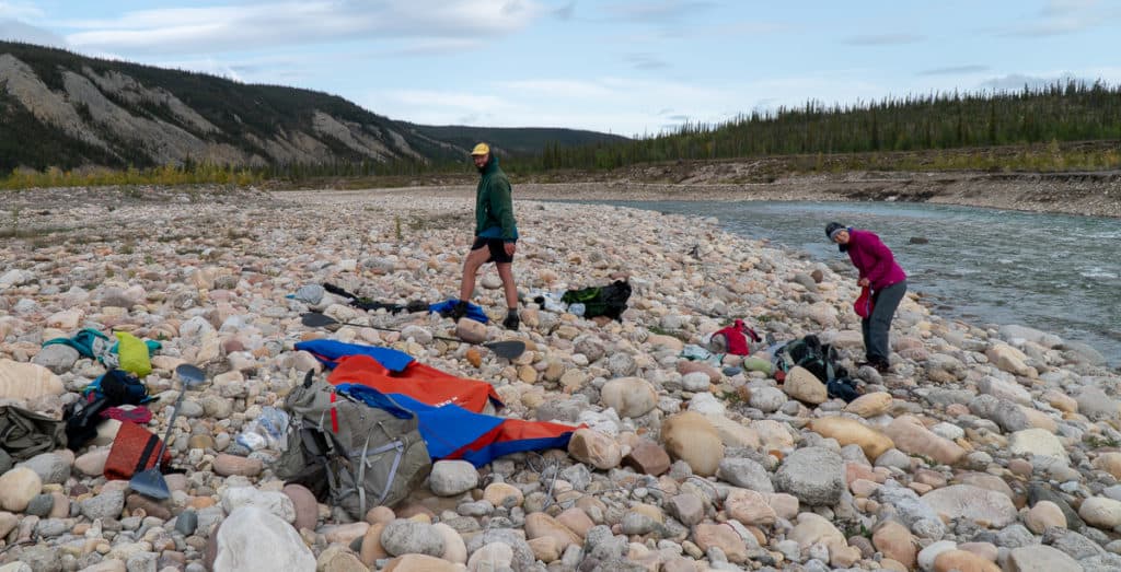 Packing up and drying off after the crossing of the little Keele River