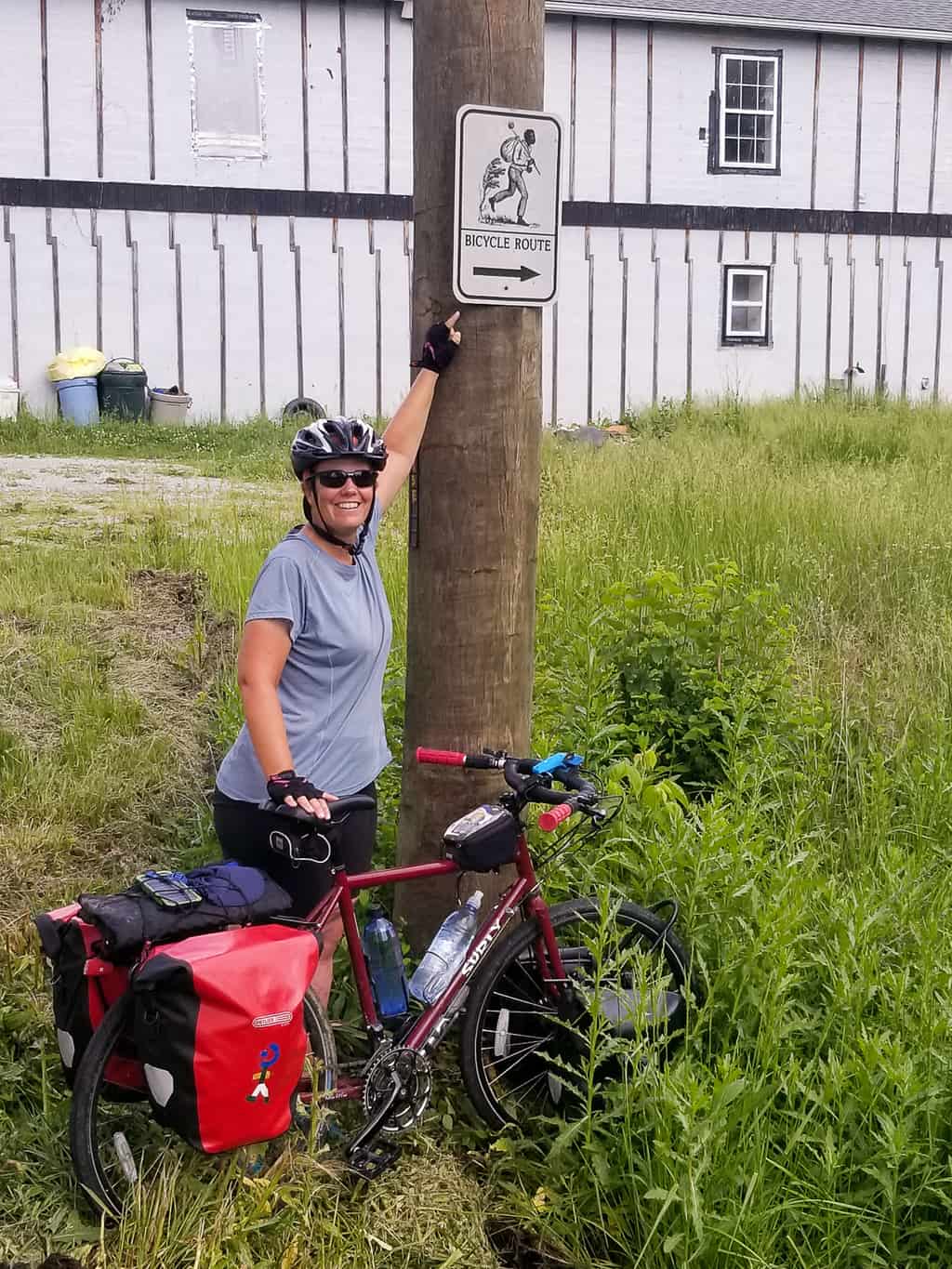 Heather pointing to a sign for the underground railroad bike route