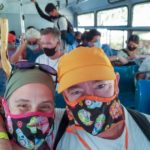 picture of matt and heather on a bus with masks on