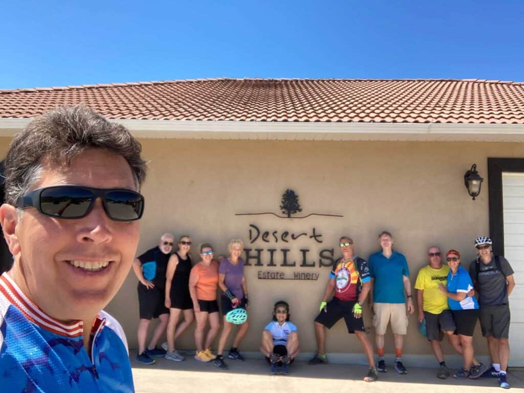 A group of people in front of a winery