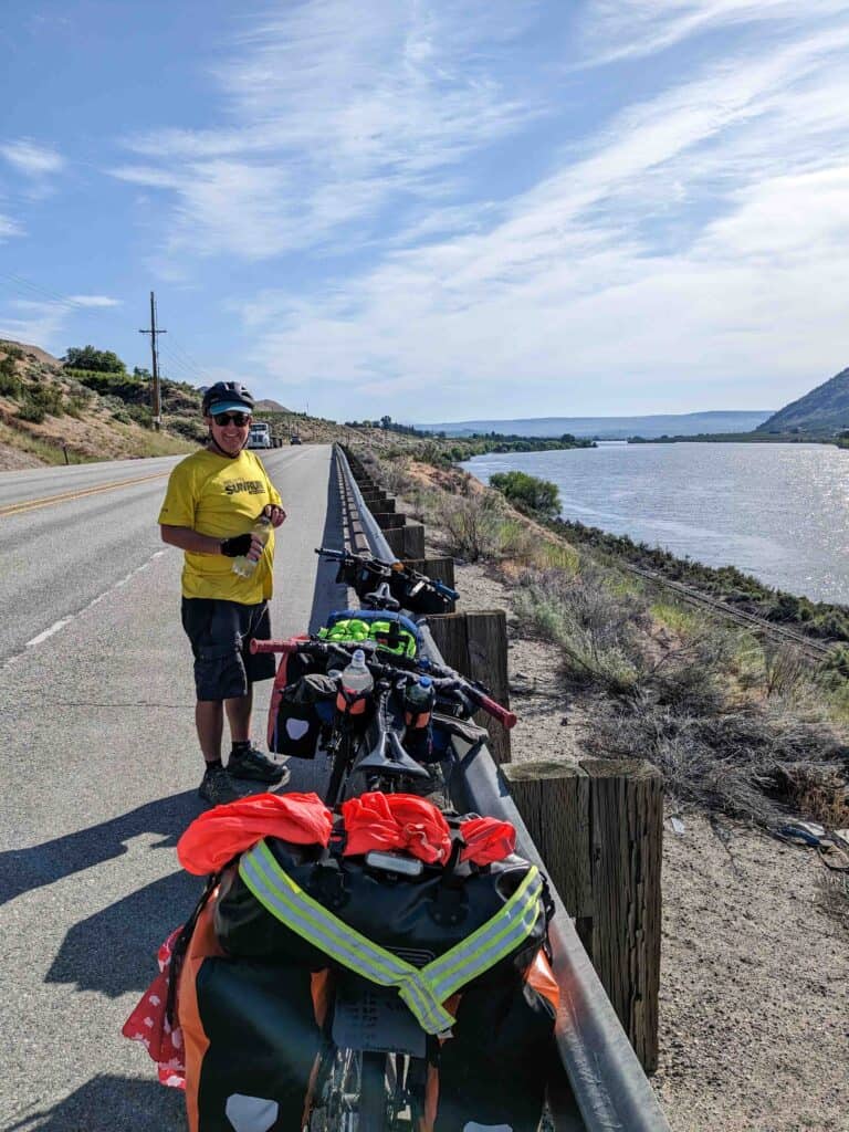 2 bicycles and a person on a highway