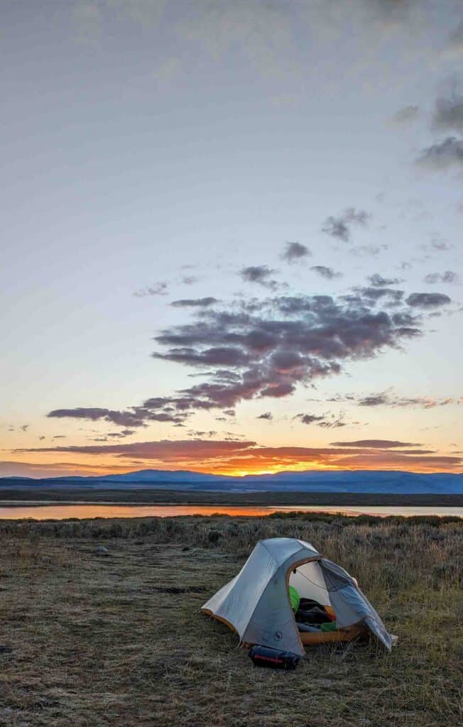 Sunrise behind a tent