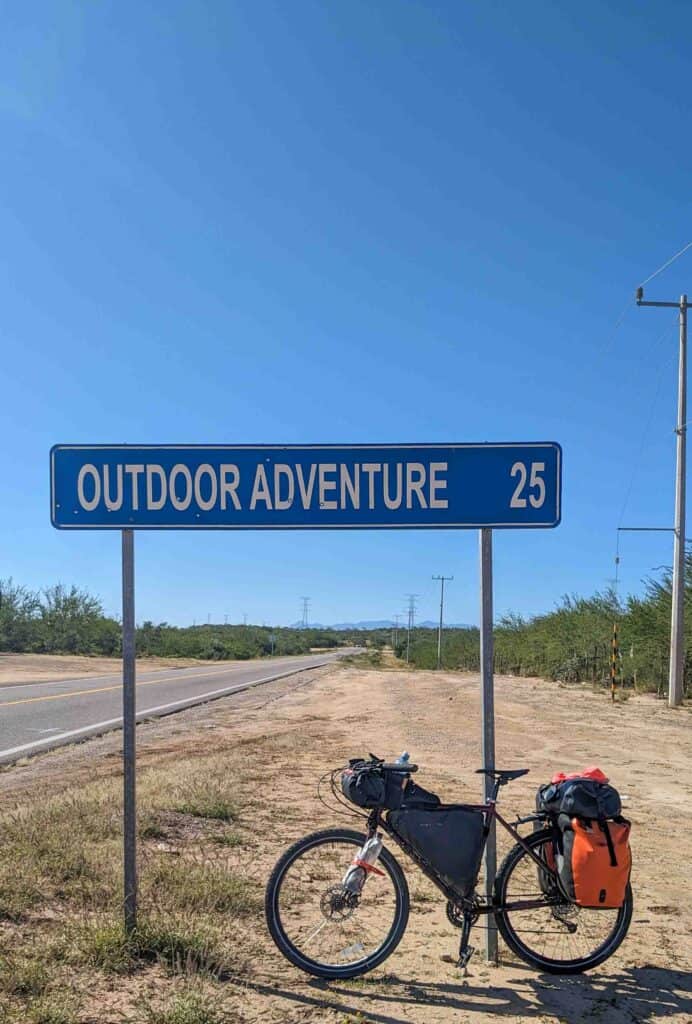 bicycle with a sign that says Outdoor Adventure